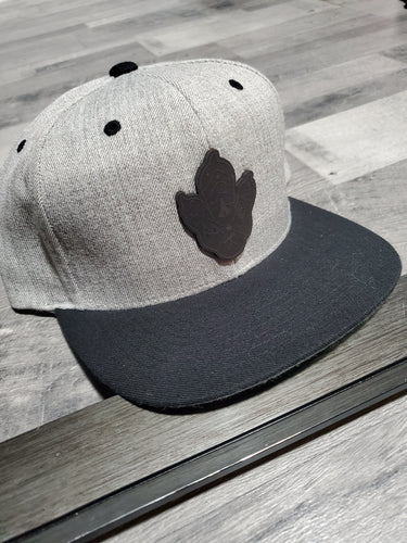 Snap Back Midnight Leather logo